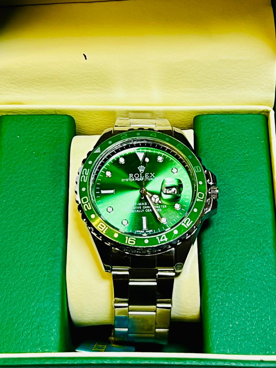 GMT style men’s stainless steel watch with green dial and green bezel